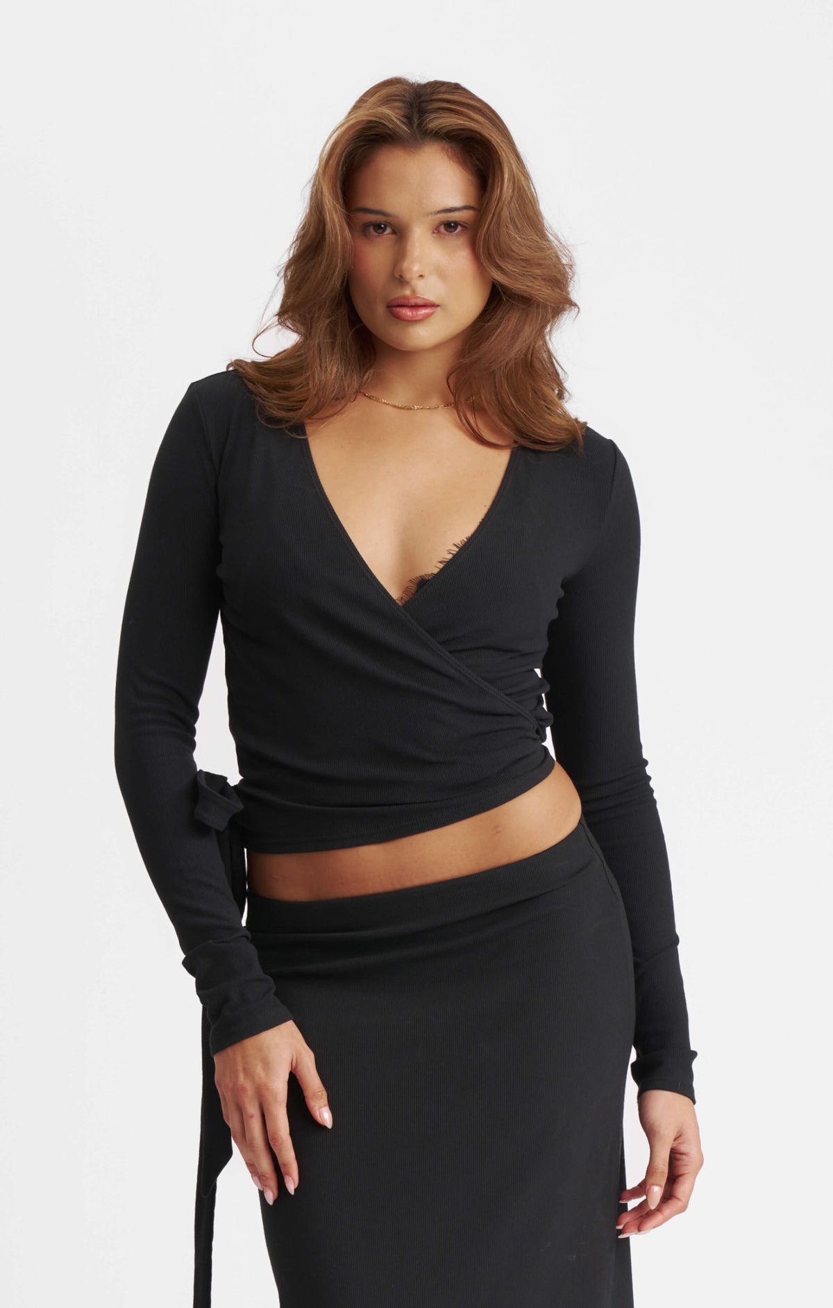 THE LUXE RIB LONG SLEEVE WRAP TOP - BLACK